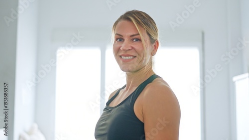 Woman smiling after fitness workout exercising at home Free Download Woman smiling after fitness workout exercising at home - GFXLoad