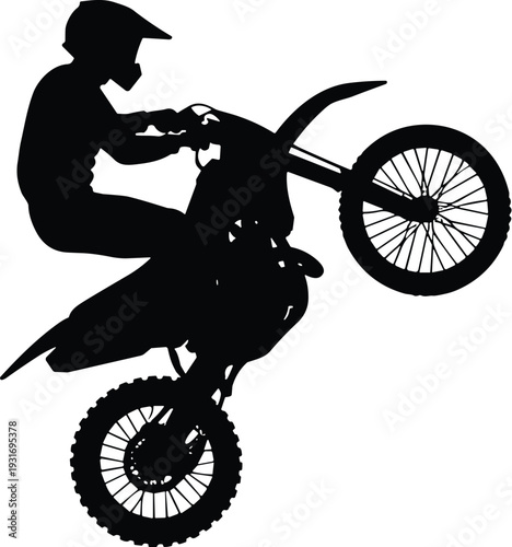 Silhouette of motocross rider performing wheelie on dirt bike, showcasing dynamic motion, action, and off-road biking sport excitement