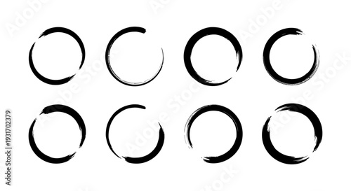 eight abstract enso brushstroke circles on a crisp white background symbolizing zen harmony and minimalist graphic design
