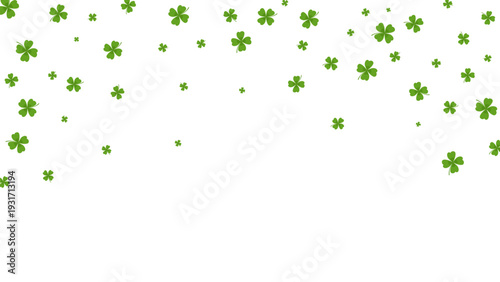 Green four leaf clover confetti scattered on for st patricks
