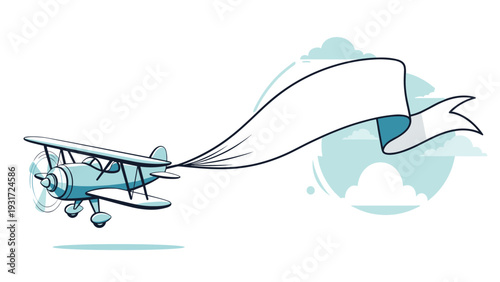 Vintage blue biplane flying through white clouds while towing a long flowing white banner for advertising purposes.