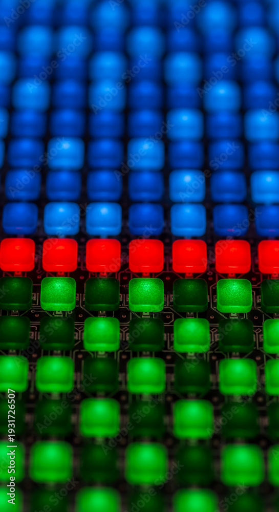 Fototapeta premium Close-up of led grid with blue, red and green lights, representing technology, digital interface, connection and pattern ideal for high-tech concepts