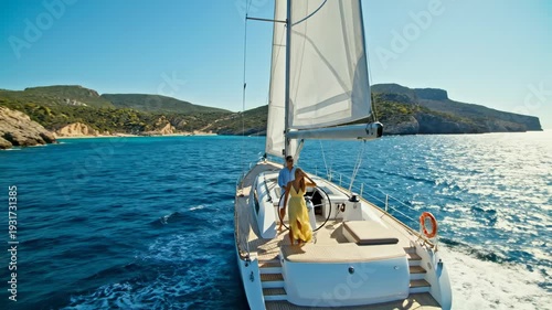 Couple Sailing on a Yacht Enjoying a Sunny Day.
