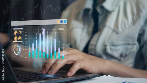 Business professional analyzing data analytics dashboard on laptop with financial charts and performance metrics, business intelligence reporting, digital marketing analysis 