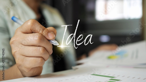 Business professional writing idea concept with pen on report paper, creative thinking, innovation planning, strategy development and startup inspiration for digital marketing and business growth.
