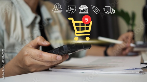Businesswoman using smartphone with online shopping cart icon and digital marketing interface, e-commerce technology, mobile payment, fintech transaction, customer experience