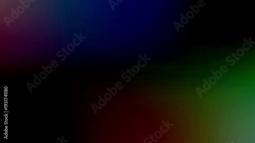 Multicolored light leaks and bokeh effects moving across a dark, abstract background