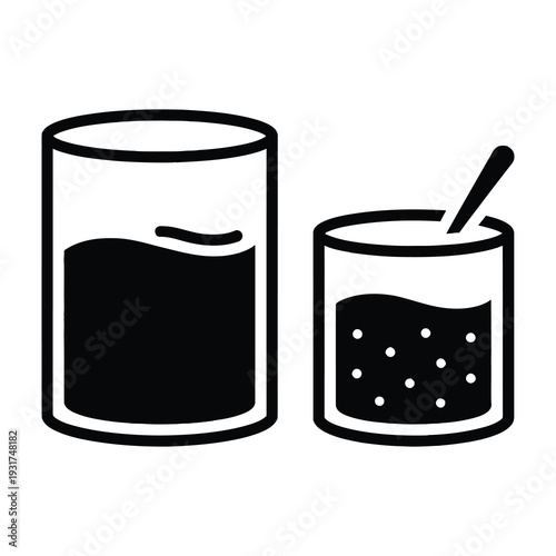Black liquid in cylindrical containers with stirring spoon for mixture