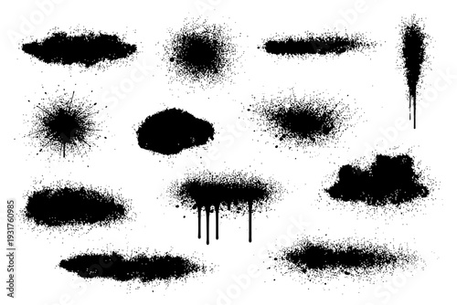 Set of grunge black spray paint splatters and drips on white background.