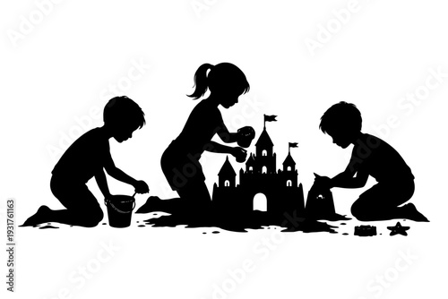 Silhouette of children building sandcastle at beach.