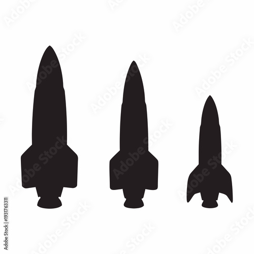 Three black silhouettes of rockets in various sizes launching upwards