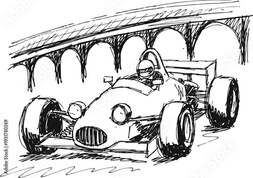 Vintage race car speeding on racetrack under arched bridge with driver helmet and racing suit
