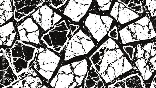 Cracked surface texture black and white broken pattern with irregular shaped fragments and sharp edges