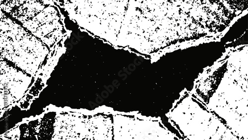 Cracked concrete surface with deep fissures and rough texture close up view