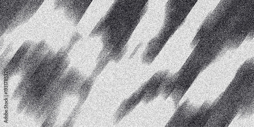 Abstract monochrome background with diagonal dark gray streaks and light gray speckles creating a sense of motion and textural depth for creative visual applications