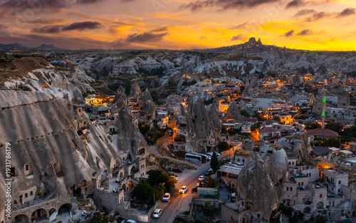 Фотография View of Goreme village with Uchisar castle in the background at sunset