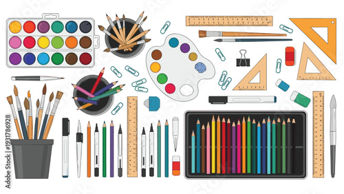 Creative art supplies collection includes watercolor paints and brushes with colored pencils and rulers for school or hobby projects.