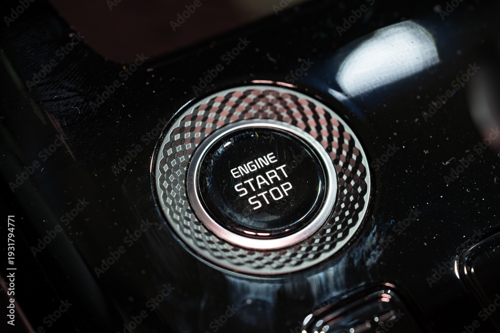 Obraz premium Close up of engine start stop button in car console