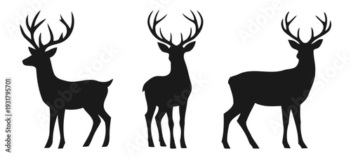 Three Deer Silhouettes with Antlers Standing.