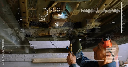 Mechanic igniting torch under car heating exhaust seam for auto repair HUD covering scene