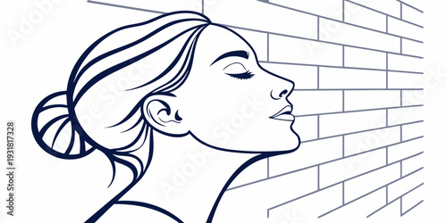 Woman with a bun enjoying the fresh air against a brick wall