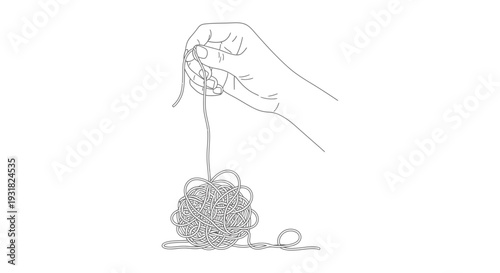 A hand holding yarn and pulling out a thread from a ball of yarn