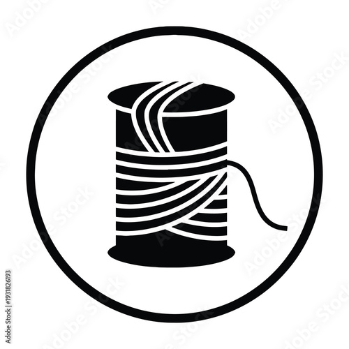 Black thread spool with loose end for sewing and crafting projects