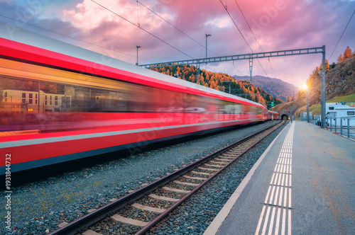 Blurred red passenger train...