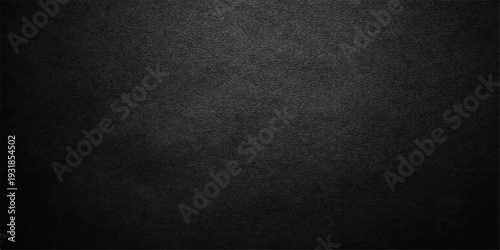 Rough black paper background with a dark grunge texture and a vintage weathered surface provides a blank charcoal material backdrop for a minimalist gray canvas wall pattern