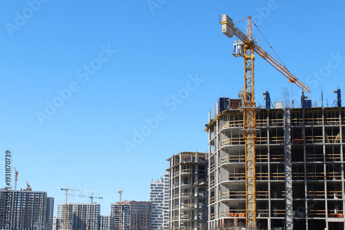 construction site with cranes, skyscrapers are being built in the city