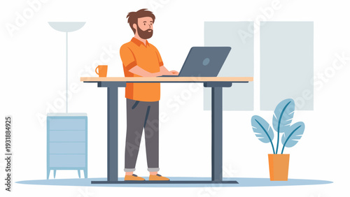 Bearded man working on laptop at standing desk in modern home office