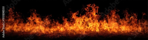 Vibrant orange and red flames dance against a dark background, creating a fiery and intense visual display.