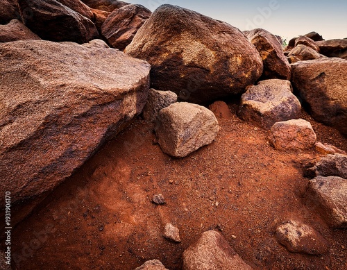 close up of rocks with brown soil or clay in between natural mineral surface
