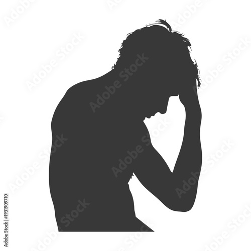 Silhouette of a man with his head in his hands