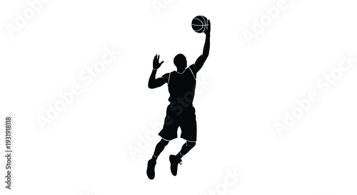 A basketball player in mid air preparing to shoot dramatic silhouette
