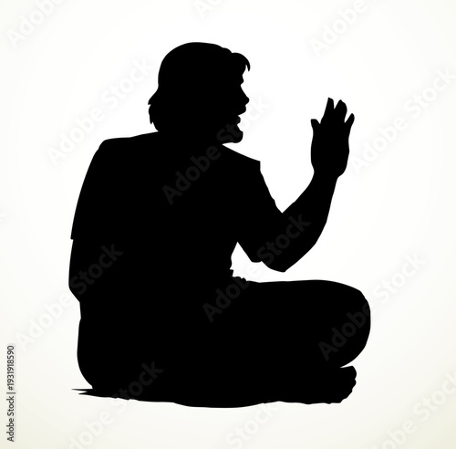 Vector drawing. Man sitting on the ground