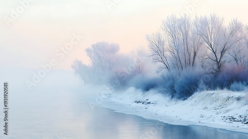Winter shoreline with frosted trees and soft mist over calm water