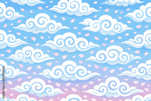 Colorful clouds float in a blue sky with pink petals scattered around during a sunny day