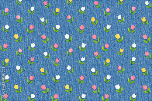 Colorful flowers on blue fabric create a pattern for crafting or decoration