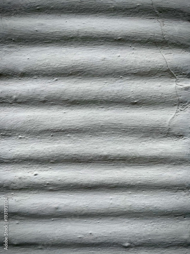 Gray ribbed concrete wall texture industrial background. Vertical