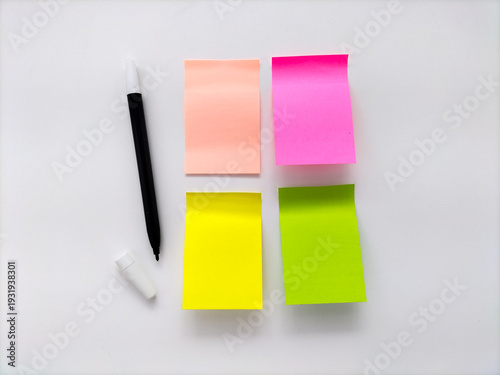 Sticky notes of various colors are arranged on a white background. 