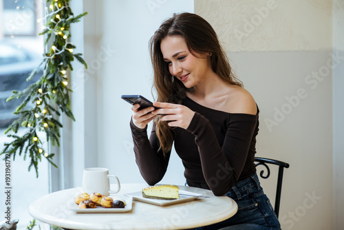 Woman enjoys dessert and us...