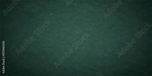 Dark green paper texture background with a rough grunge material pattern and blank vintage canvas surface for design