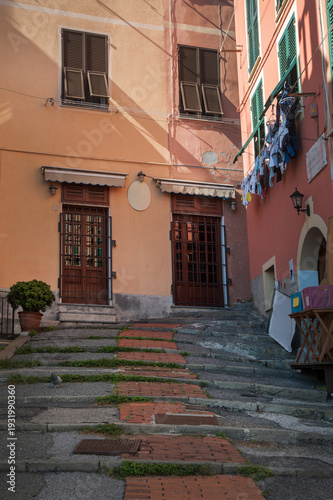 Picturesque street with cobblestone stairs and colorful houses, Nervi
