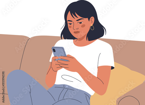 A young woman sitting comfortably on a couch and using her smartphone