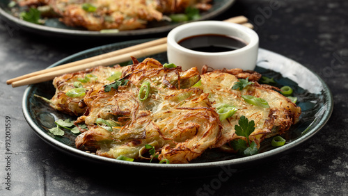 Korean cabbage pancake with vegetables and soy sauce. Asian food style