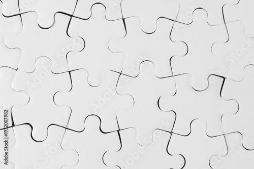 Top-Down View of Connected White Jigsaw Puzzle Pieces 
