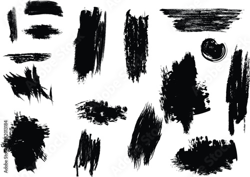 Collection of black brush strokes and smudges on a white background