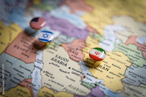 Political map of the Middle East with flag pins of USA, Israel, and Iran on key geographic locations, representing international relations and geopolitical alliance concept