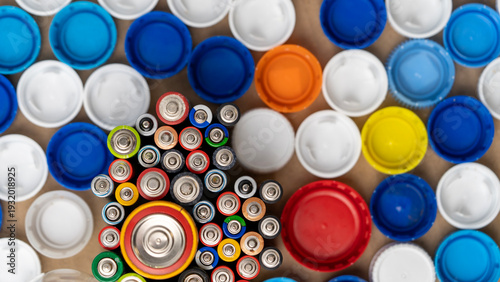 Billede på lærred A bunch of batteries and caps are scattered on a table